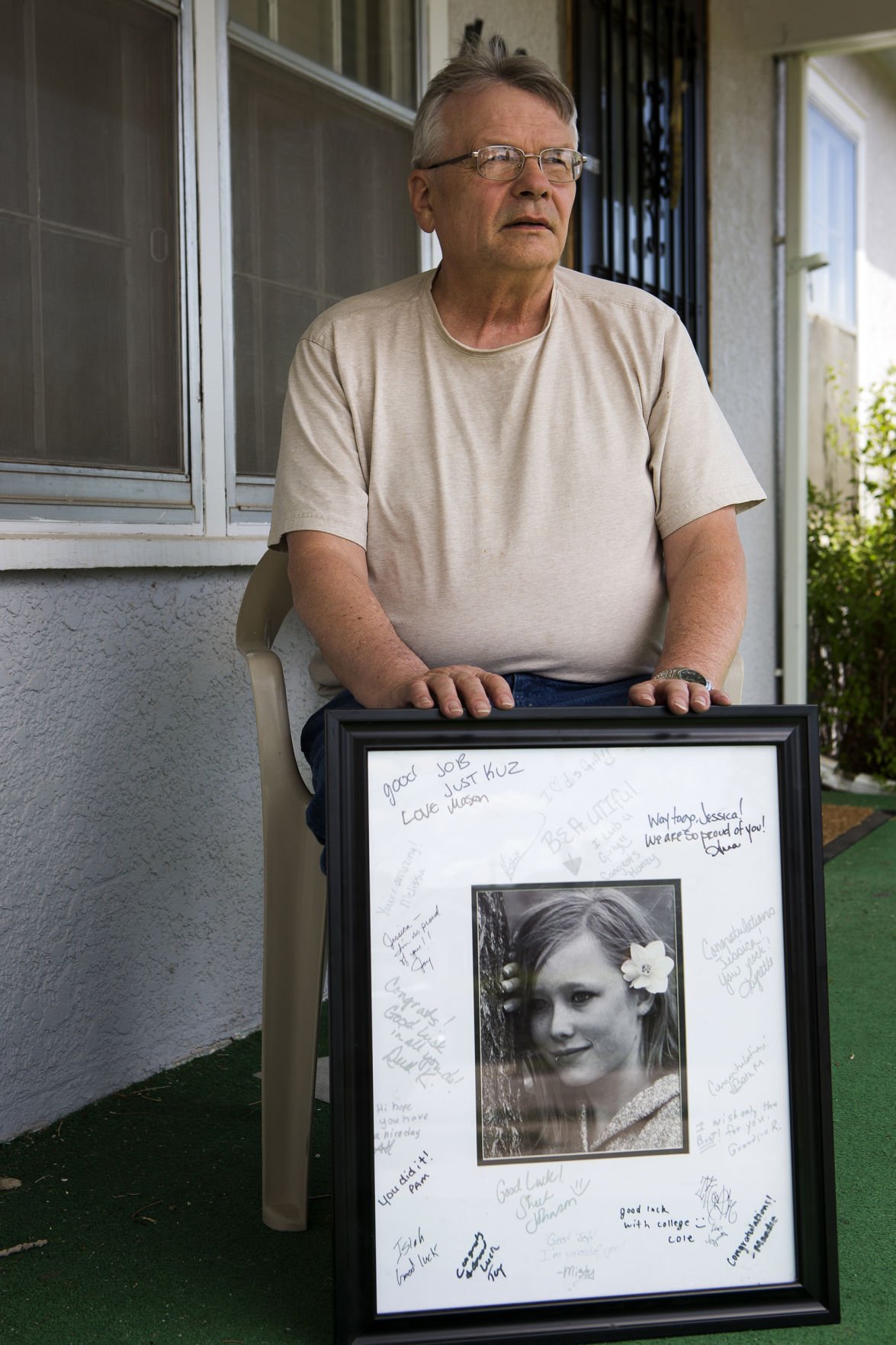 John Rehfeld with a photo of Jessica Rehfeld